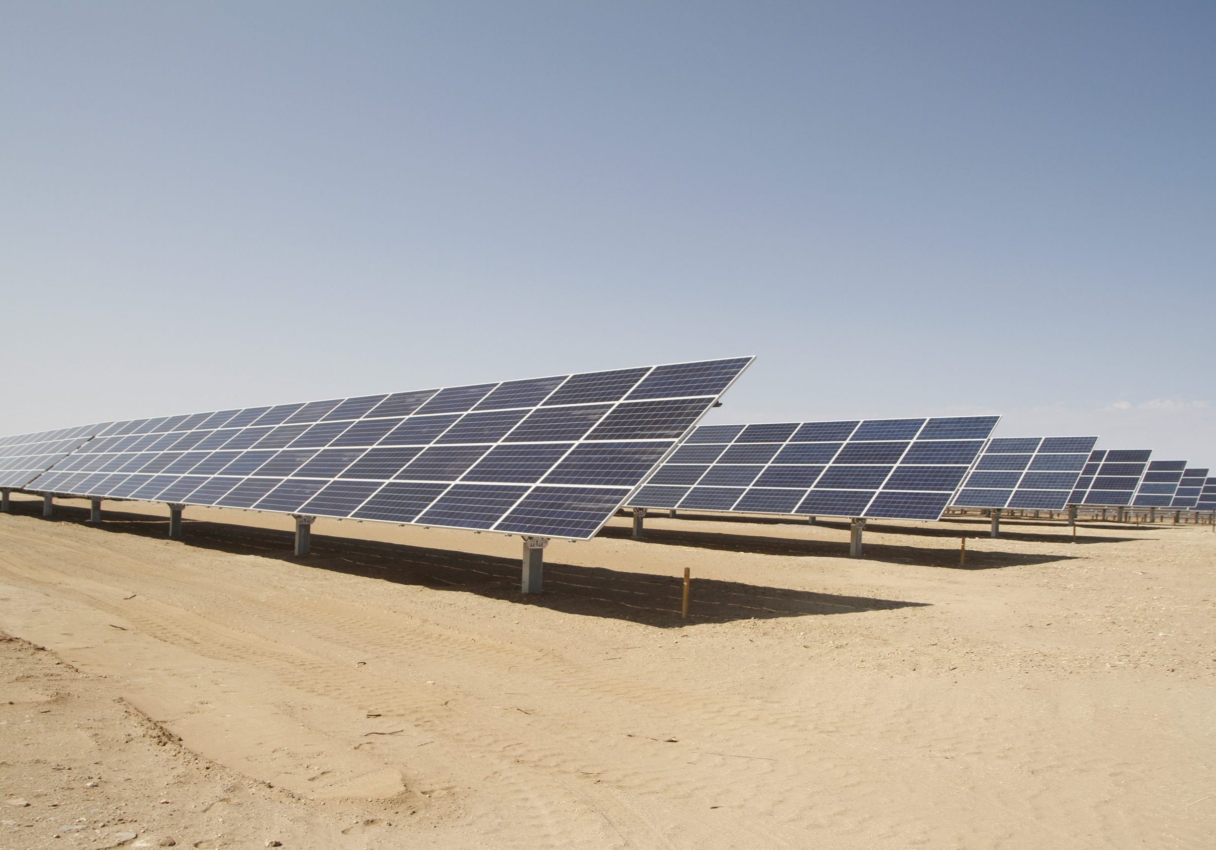 Big solar panel system on sand.